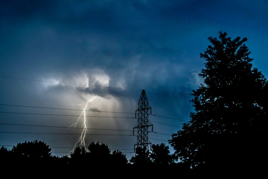 Lightning storm over powerlines causing a blackout